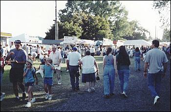 Picture of people wandering toward food.