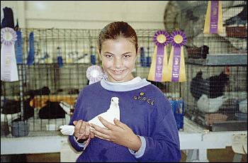 Grace MountainSpring with her pigeon.