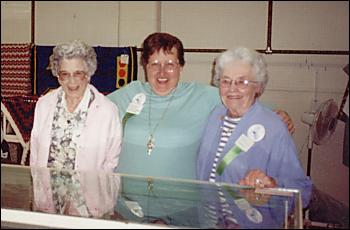 Picture of 3 ladies at the indoor exhibit building