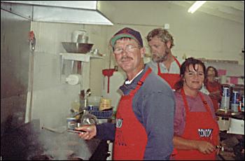 Picture of High School parents cooking hamburgers.