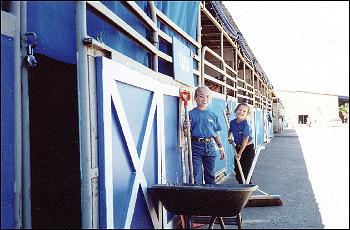 Saadra and Johanna Straw on horse cleanup duty