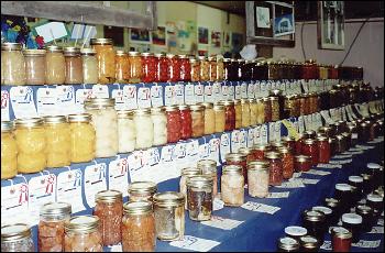 large display of canning jars full of food