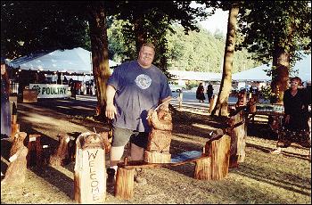 Picture of Todd Whited with his cedar critters.