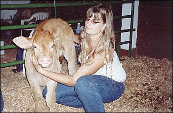 Picture of Lisa Letsch with 2 week old calf.