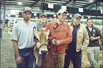 Picture of 6 year old dairy cow and boys.