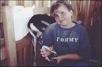 Picture of Heather trimming goat hoof.